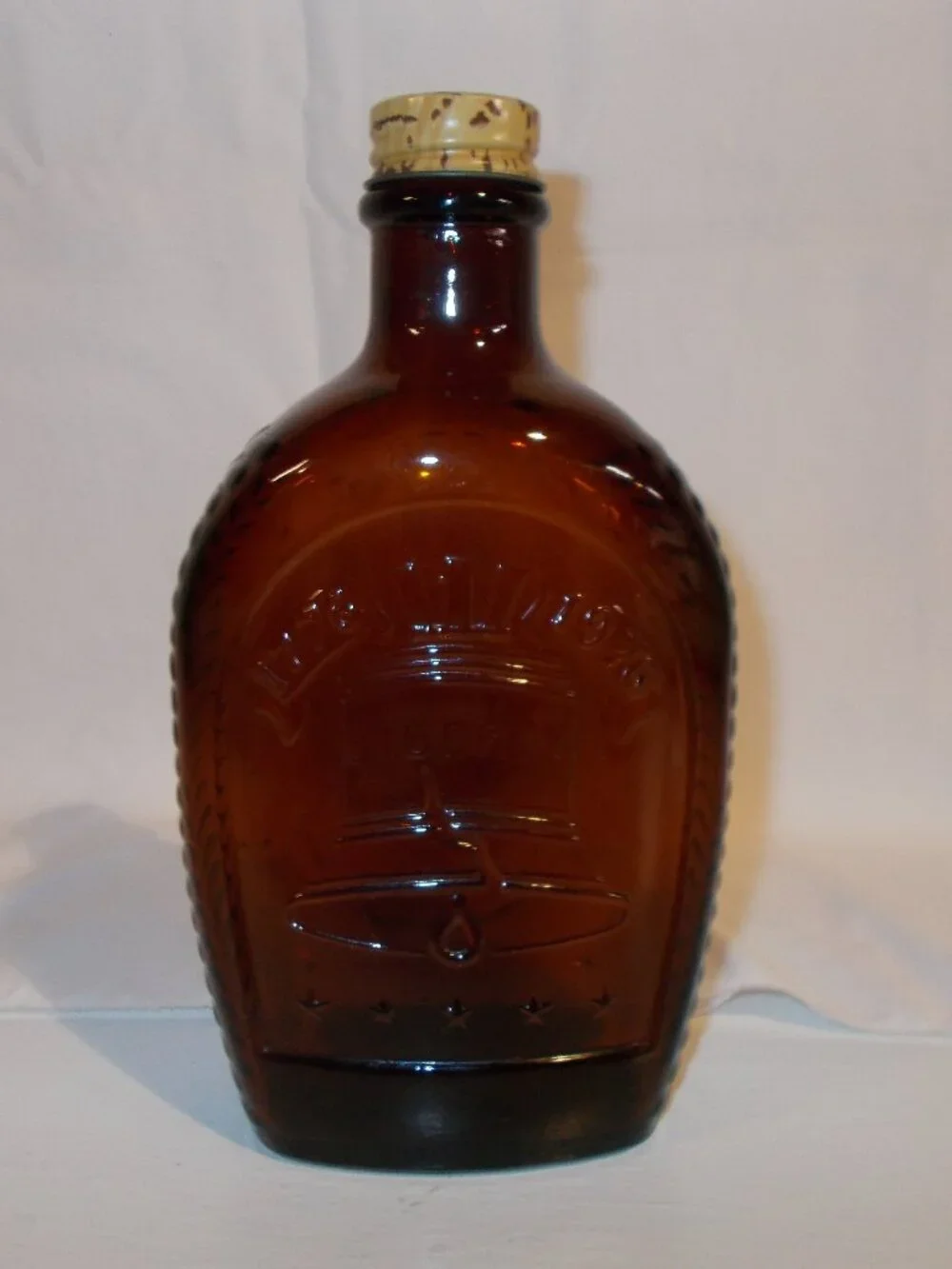 1976 Vintage Log Cabin Syrup Liberty Bell bicentennial bottle, amber color EMPTY